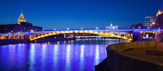 Image showing panorama of Moscow city with lighting Smolensky bridge and river
