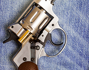 Image showing Nagan revolver with cartridge