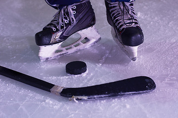 Image showing hockey sticsk and puck on ice