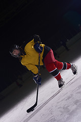 Image showing teen ice hockey player in action