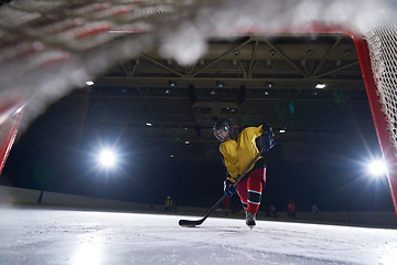 Image showing teen ice hockey player in action