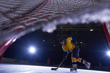 Image showing teen ice hockey player in action