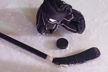 Image showing hockey sticsk and puck on ice