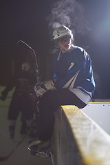 Image showing ice hockey players on bench