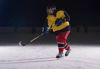 Image showing teen ice hockey player in action