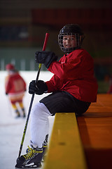 Image showing children ice hockey players on bench