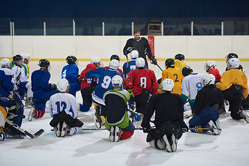 Image showing ice hockey players team meeting with trainer