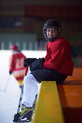 Image showing children ice hockey players on bench