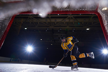 Image showing teen ice hockey player in action