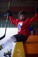 Image showing children ice hockey players on bench