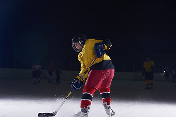 Image showing teen ice hockey player in action