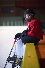 Image showing children ice hockey players on bench