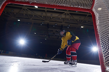 Image showing teen ice hockey player in action