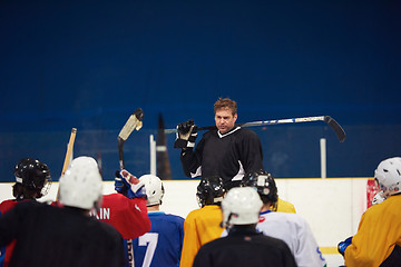 Image showing ice hockey players team meeting with trainer