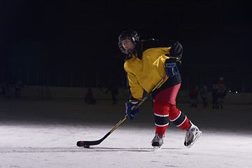 Image showing teen ice hockey player in action