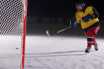 Image showing teen ice hockey player in action