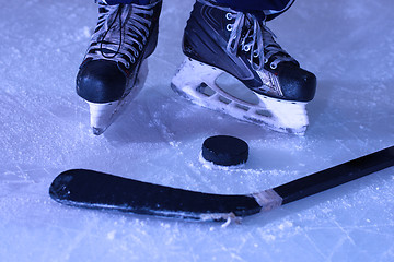 Image showing hockey sticsk and puck on ice