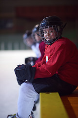 Image showing children ice hockey players on bench