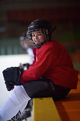 Image showing children ice hockey players on bench