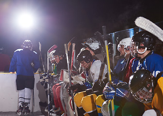 Image showing ice hockey players on bench