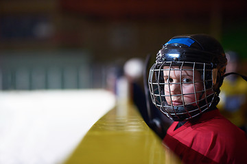 Image showing children ice hockey players on bench