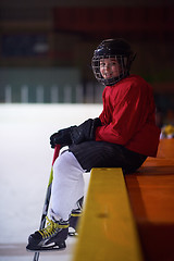 Image showing children ice hockey players on bench