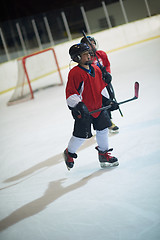 Image showing children ice hockey players on bench