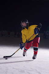 Image showing teen ice hockey player in action