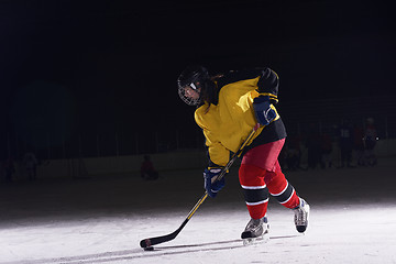 Image showing teen ice hockey player in action