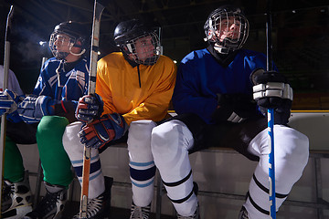 Image showing ice hockey players on bench