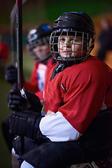 Image showing children ice hockey players on bench