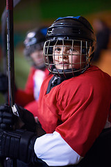 Image showing children ice hockey players on bench