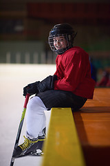 Image showing children ice hockey players on bench