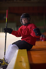 Image showing children ice hockey players on bench