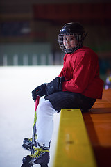 Image showing children ice hockey players on bench