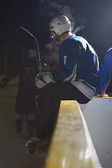 Image showing ice hockey players on bench