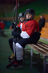 Image showing children ice hockey players on bench