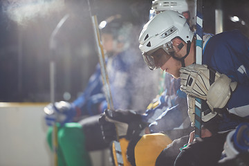 Image showing ice hockey players on bench