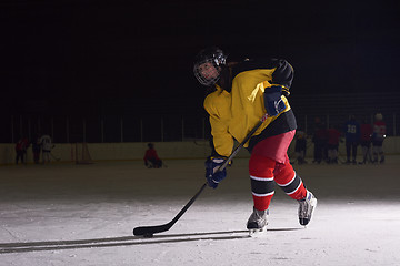 Image showing teen ice hockey player in action