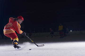 Image showing teen ice hockey player in action