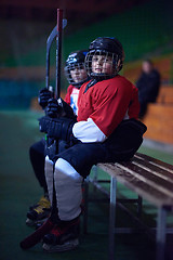 Image showing children ice hockey players on bench