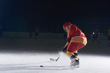 Image showing teen ice hockey player in action