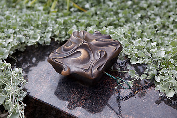 Image showing Holy water shell at the grave