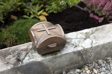 Image showing Holy water shell at the grave