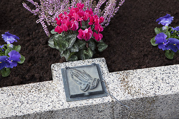 Image showing Holy water shell at the grave