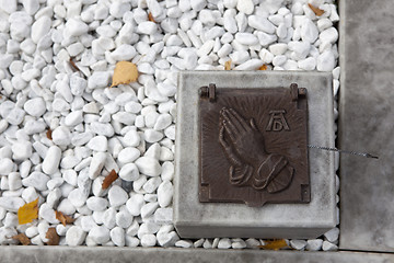 Image showing Holy water shell at the grave