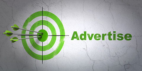 Image showing Advertising concept: target and Advertise on wall background