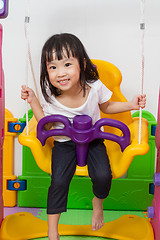 Image showing Asian Chinese little girl playing on swing