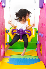 Image showing Asian Chinese little girl playing on swing