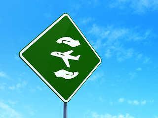 Image showing Insurance concept: Airplane And Palm on road sign background